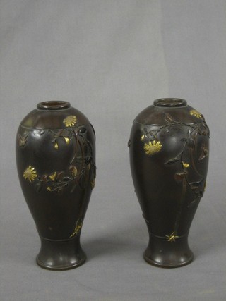A pair of 19th Century Japanese bronze vases decorated birds amidst flowering branches, the base with signature 7"
