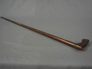 A mahogany walking cane the top inset a Royal Flying Corps crest, probably made from aircraft strut