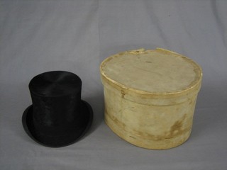 A gentleman's black silk hat, size 7 1/4,