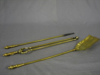 A brass 3 piece fireside companion set comprising shovel, poker and fire tongs