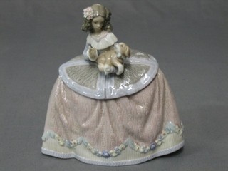 A Lladro figure of a standing lady in a crinoline dress with dog, base impressed 5410 7"