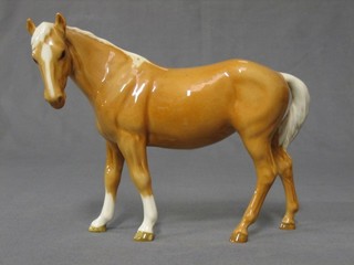 A Beswick figure of a standing Palomino horse 7"