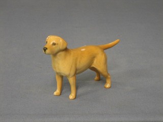 A  Beswick figure of a standing yellow Labrador, 3" (paw marked 27)