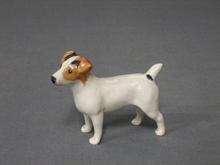 A Beswick figure of a standing Jack Russell, (paw marked 31) 2 1/2"