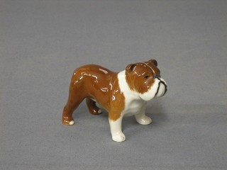 A Beswick figure of a standing Bull Dog (paw marked K), 2"