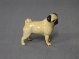 A Beswick figure of a standing pug, (paw marked 71?) 2 1/2"
