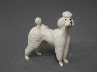 A Beswick figure of a standing white Poodle, 3 1/2"