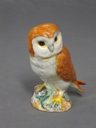 A Beswick figure of a seated brown and white owl, base marked Beswick and impressed 202620 4 1/2" 