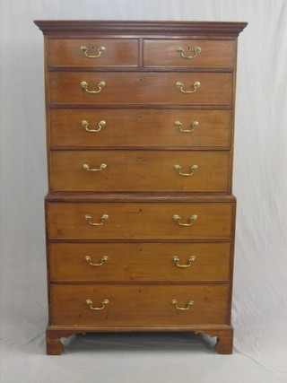 A Georgian mahogany chest on chest with moulded and dentil cornice fitted 2 short and 6 long drawers, raised on bracket feet with brass escutcheons and swan neck drop handles 41"