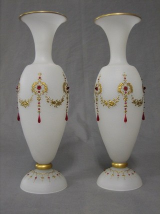 A handsome pair of Victorian opaque glass trumpet shaped vases with gilt and red applied  jewel decoration, raised on circular spreading feet (2 jewels chipped and gilt rubbed to 1 vase) 14"