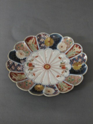 A 19th Century circular Japanese Imari porcelain plate with lobed body, gilt and floral decoration, the base with 6 character mark 7"