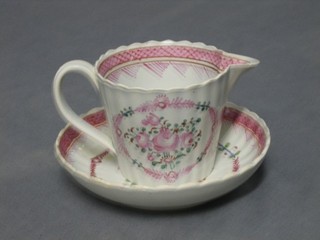 An 18th Century Oriental style jug (slight chip to rim) with strap work handle 3" together with a matching saucer