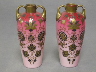 A pair of Victorian opaque glass twin handled vases with applied gilt floral decoration 7 1/2"