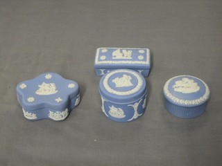 A Wedgwood blue Jasperware trinket box  and cover, marked 63, 3", a shaped jar and cover marked 67 3", a circular jar and cover with reeded body, 2", a circular jar and cover base marked 62, 2"