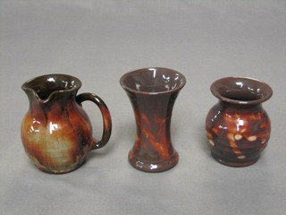 An Enenny waisted pottery vase, the base marked Enenny Pottery, 4", a circular club shaped vase 3 1/2" and a circular jug 3 1/2"