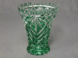 A cut green glass overlay vase 7"