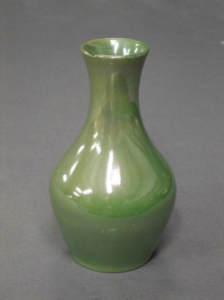 A Moorcroft green glazed club shaped vase, the base impressed Moorcroft Burslem and impressed 372, 5" (chip to rim)