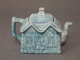 An Arthur Price blue glazed cottage teapot, the base marked Ye Olde Cottage Made in England
