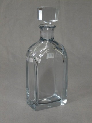 A plain glass bottle shaped decanter and stopper, the base with signature and marked E102