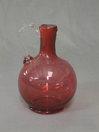 A Victorian cranberry glass ewer with clear glass stem 8" (spout f)