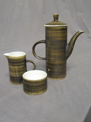 A 1960's Cinque Port  pottery  coffee pot, cream jug and sugar bowl (coffee pot cracked)