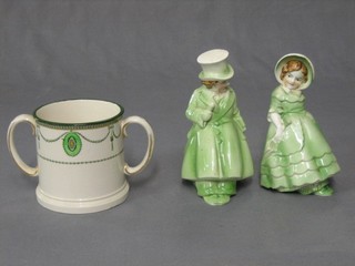A Royal Doulton Countess pattern twin handled mug and a pair of green glazed Art Deco pottery book ends in the form of a lady and gentleman 6 1/2"