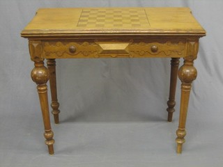 A 19th/20th Century French oak games table, the top inlaid a chess board, the interior inlaid a backgammon board 35"
