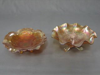 An orange Carnival glass dish raised on 3 clear feet and 1 other 8"