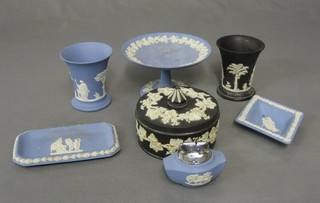 A Wedgwood blue Jasperware tazza 6", 2 waisted vases 4", a circular jar and cover 5", 2 pin trays and an ashtray