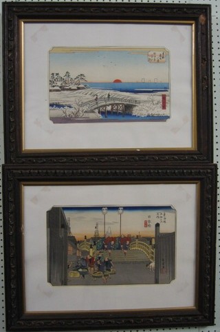 A pair of 19th Century Oriental coloured prints "Bridges" 9" x 14" contained in carved oak frames