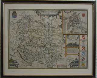 John Speed, a coloured map of Herefordshire, (crease to the middle and slight tear to the bottom) contained in a double sided Hogarth frame 15" x 19"