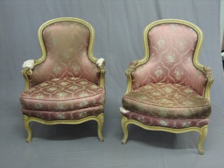 A pair of 19th/20th Century French tub back salon chairs upholstered in pink satin material