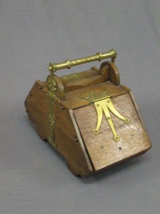 A Victorian honey oak and brass banded coal box with hinged lid 24"