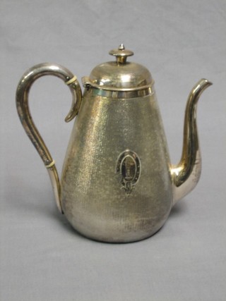A silver plated coffee pot with engine turned decoration