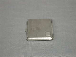A silver cigarette case with engine turned decoration 1928, 2 ozs