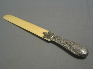 A Victorian silver and ivory newspaper opener, the embossed silver handle decorated a lady, London 1886
