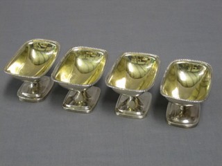A harlequin set of 4 George III Scots silver and later? French salts with parcel gilt interiors, raised on oval spreading feet, 2 marked to the side, 1 marked to the bottom and 1 with no mark, 12 ozs