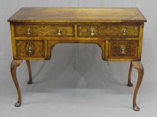 A 1930's Queen Anne style figured walnut writing table with crossbanded top, fitted 2 long drawers above 2 short drawers, raised on cabriole supports 41"