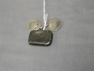 A small silver vesta case together with 2 silver watch chain medallions
