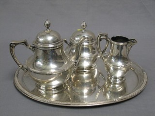 A German silver 4 piece tea service comprising oval tea tray, teapot, cream jug, twin handled sucrier all with ribbon decoration, the base marked 800, 60 ozs 