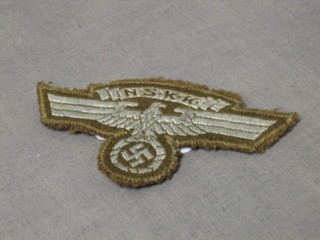 A Nazi German NSKK eagle cloth badge (ambulance auxiliary)