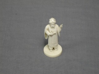 An Eastern carved ivory figure of a standing sage 3"
