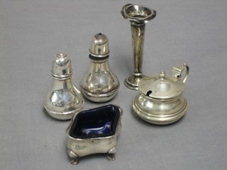 A silver specimen vase 3" and a 4 piece matched silver condiment set comprising mustard pot, salt and 2 peppers