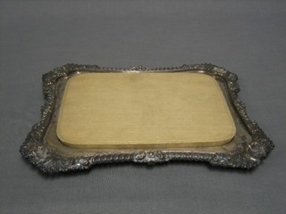 A rectangular silver plated bread board holder with gadrooned borders by Walker  & Hall