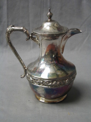 A circular silver plated hotwater jug with cast borders by James Dixon & Sons