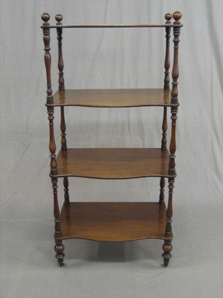 A Victorian mahogany 4 tier what-not stand of serpentine outline 22"