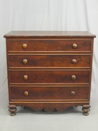 A 19th Century mahogany chest of 4 long drawers with tore handles, raised on bun feet 42"