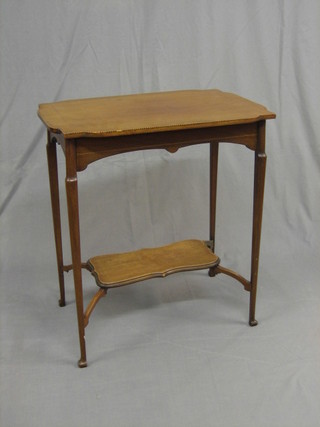 An Edwardian Art Nouveau rectangular inlaid mahogany 2 tier occasional table, raised on turned supports 25"