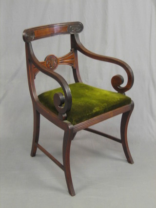 A 19th Century mahogany bar back desk chair with carved mid rail and upholstered drop in seat, raised on sabre supports