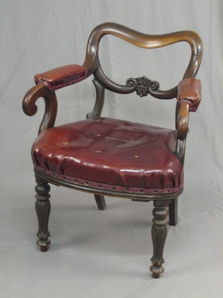 A William IV mahogany spoon back desk chair with carved mid rail and upholstered seat, raised on turned and reeded supports (old break to back)